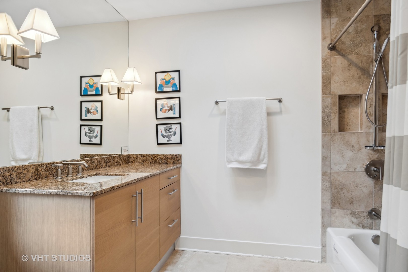 Undisclosed Address Highland Park, IL 60035 - Photo 21 of 32 a bathroom with a granite countertop sink a toilet and shower