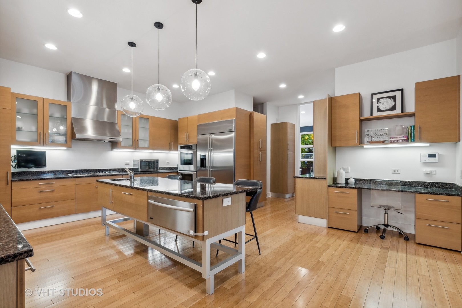 Undisclosed Address Highland Park, IL 60035 - Photo 7 of 32 a kitchen with stainless steel appliances granite countertop a stove a sink a refrigerator and a microwave