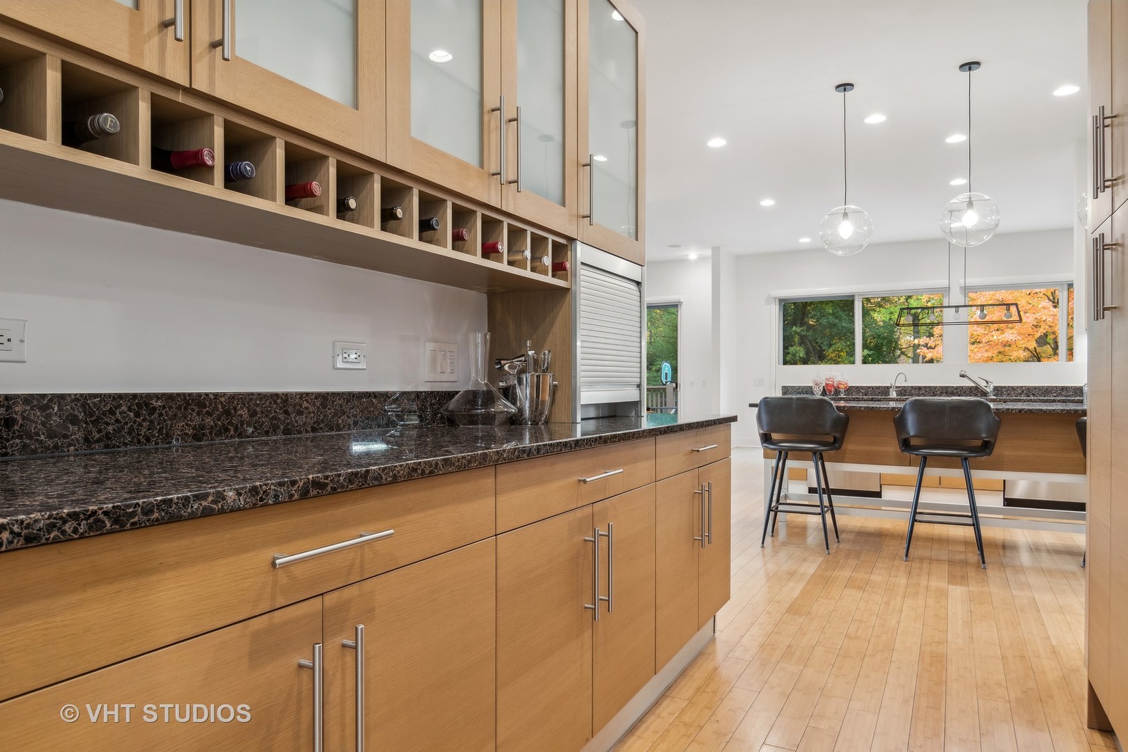 Undisclosed Address Highland Park, IL 60035 - Photo 8 of 32 a kitchen with stainless steel appliances granite countertop a stove a sink a dining table and chairs with wooden floor