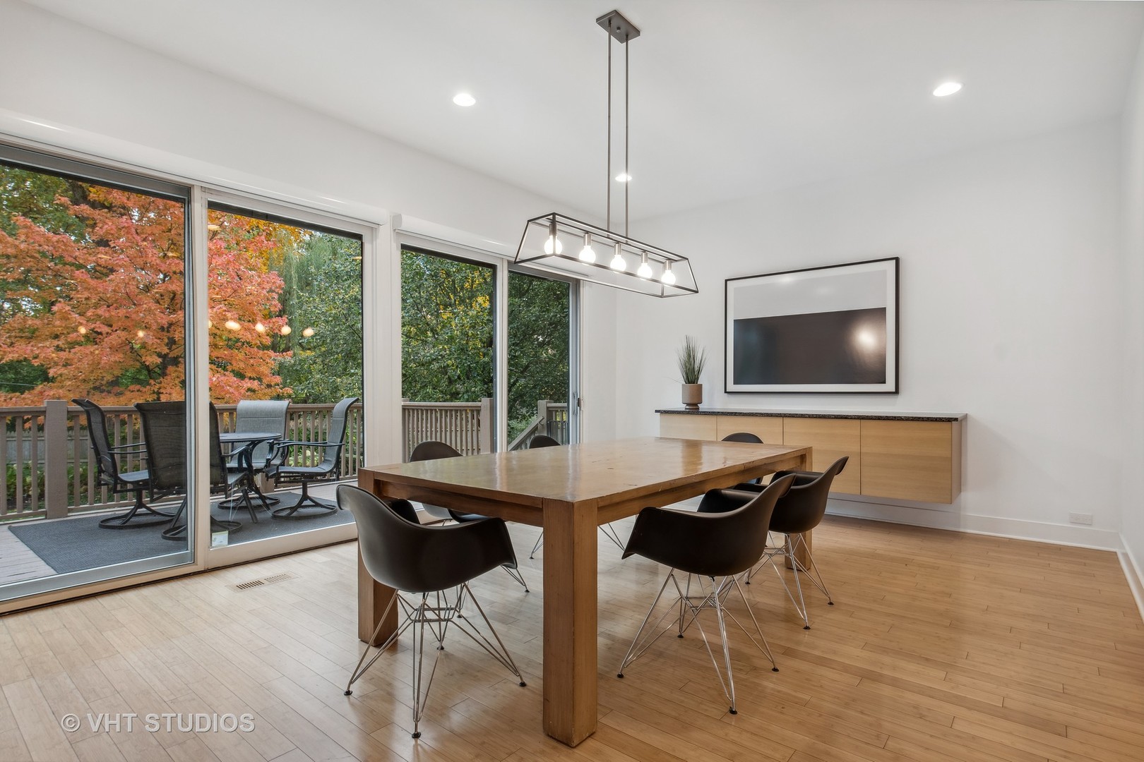 Undisclosed Address Highland Park, IL 60035 - Photo 10 of 32 a living room with furniture a flat screen tv and a large window