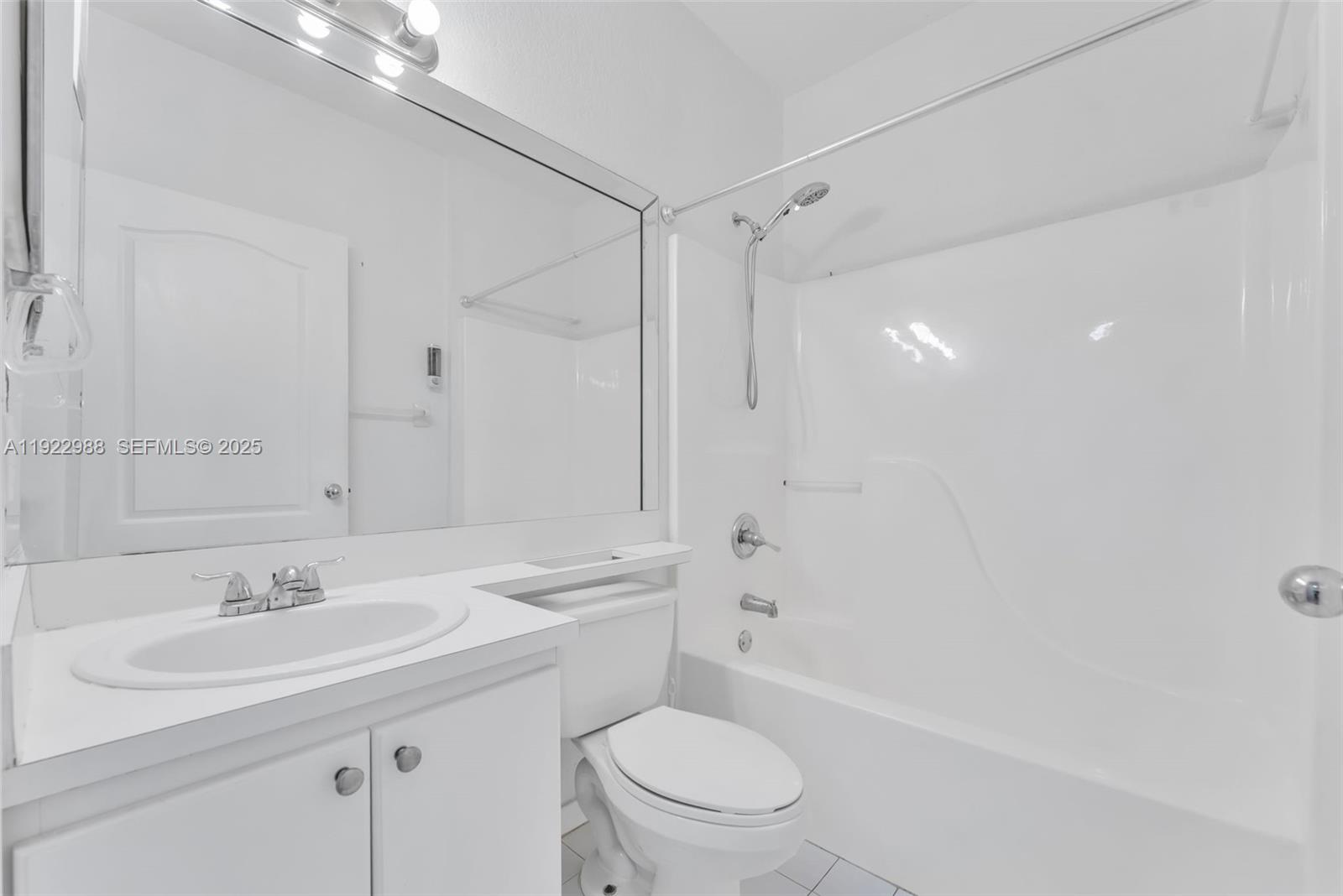 7665 Northwest 183rd Terrace, Unit 1405 Hialeah, FL 33015 - Photo 12 of 26 a bathroom with a sink toilet vanity and shower