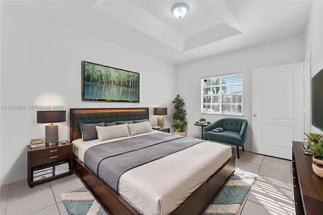 a bedroom with bed and a couch