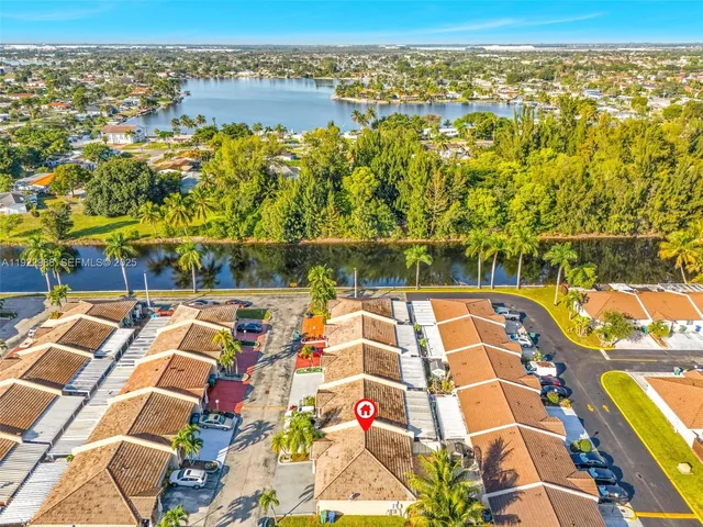 an aerial view of residential houses with outdoor space