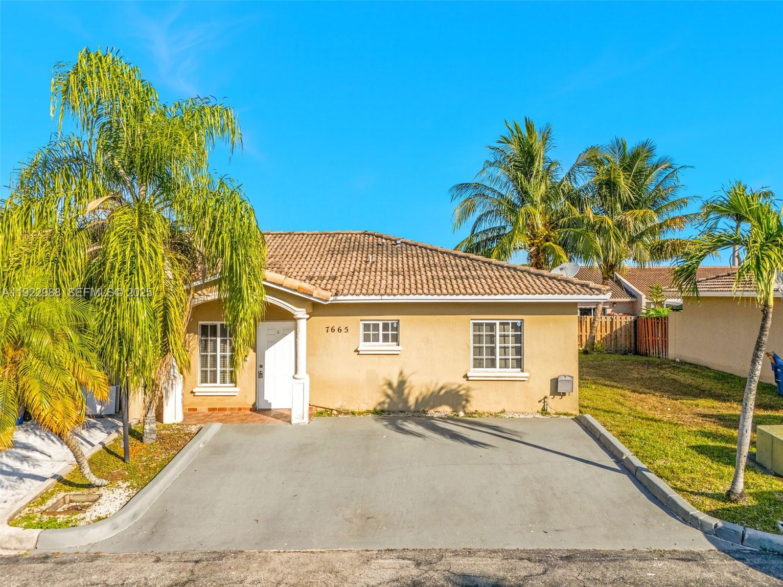 7665 Northwest 183rd Terrace, Unit 1405 Hialeah, FL 33015 - Photo 26 of 26 a view of a house with a patio