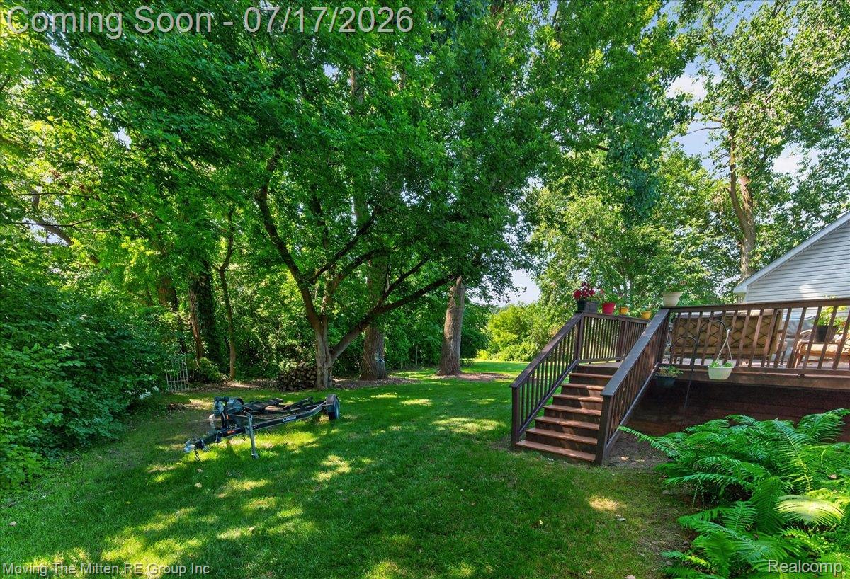 40162 Alden Road Belleville, MI 48111 - Photo 46 of 67 Expansive green lawn with mature trees and dense perimeter foliage