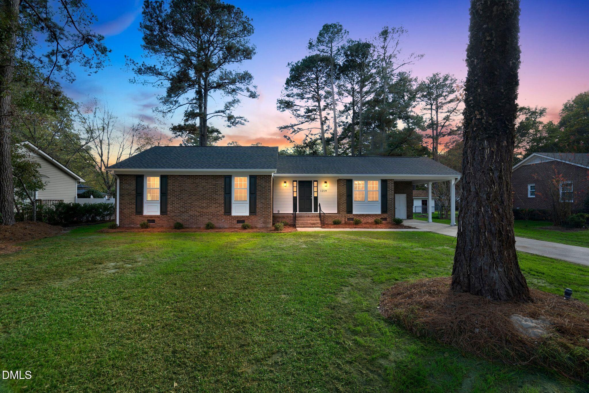 1219 Queen Anne Road Northwest Wilson, NC 27896 - Photo 1 of 26 a view of a house with a yard