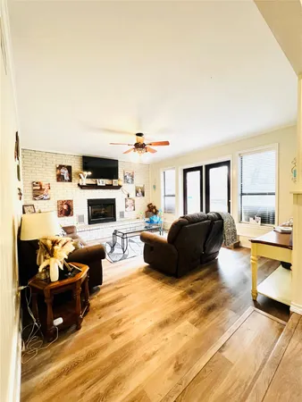 a living room with furniture fireplace and a flat screen tv