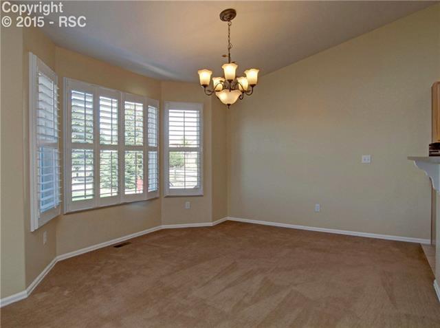 8756 Del Rio Road Peyton, CO 80831 - Photo 8 of 31 Dining Room with bay window and plantation shutters