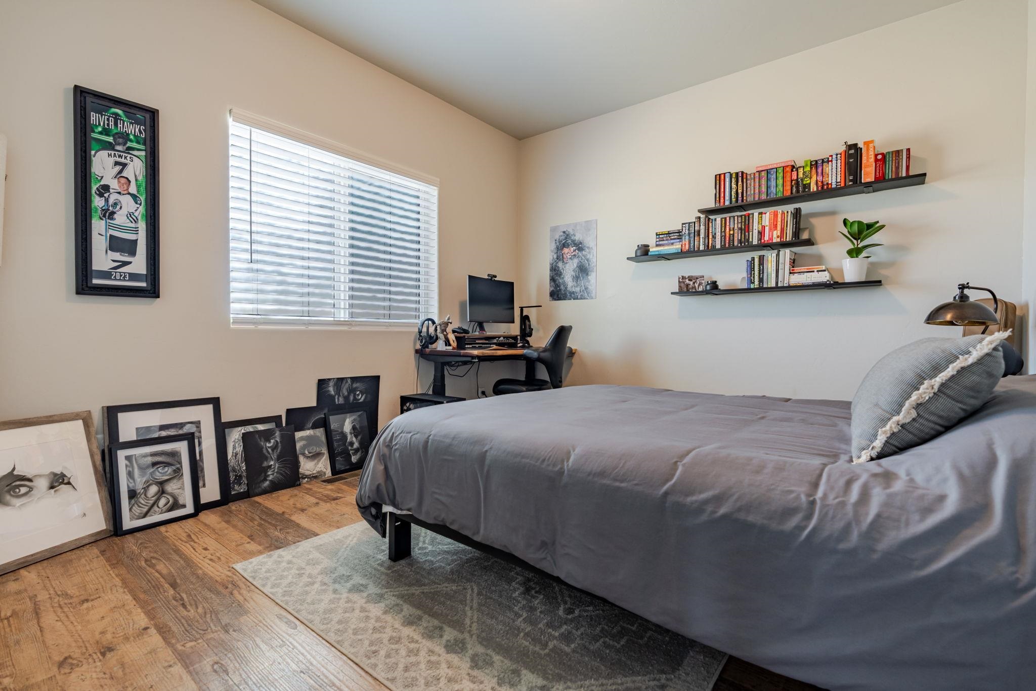 1301 M Road Loma, CO 81524 - Photo 23 of 32 a bedroom with a bed and a table in it