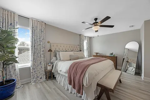 a bedroom with bed and window