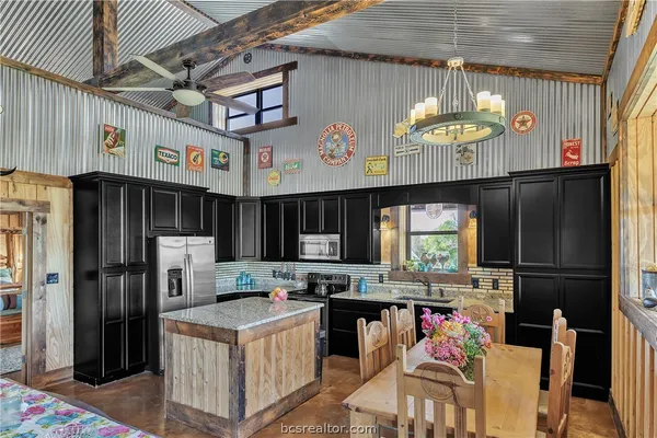 a kitchen with refrigerator and window