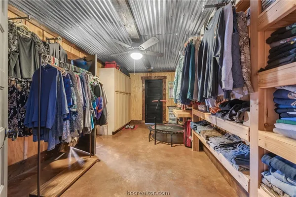 a view of dirt yard with a large tree