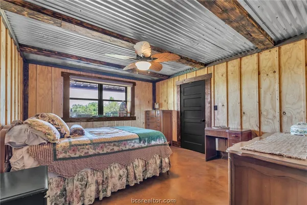 a view of a green field with an trees