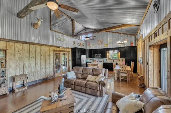 a kitchen with stainless steel appliances granite countertop a stove refrigerator and cabinets