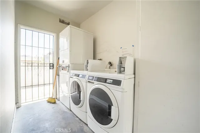 a view of a storage & utility room with washer and dryer