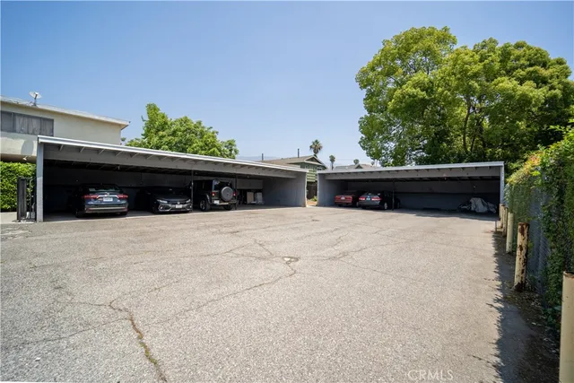 a view of a car in front of a building