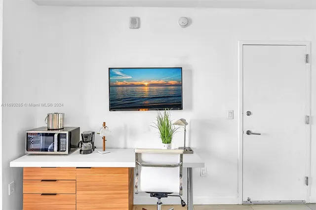 a room with a couch and a flat screen tv