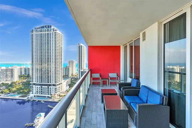 a view of hall way with furniture and stairs