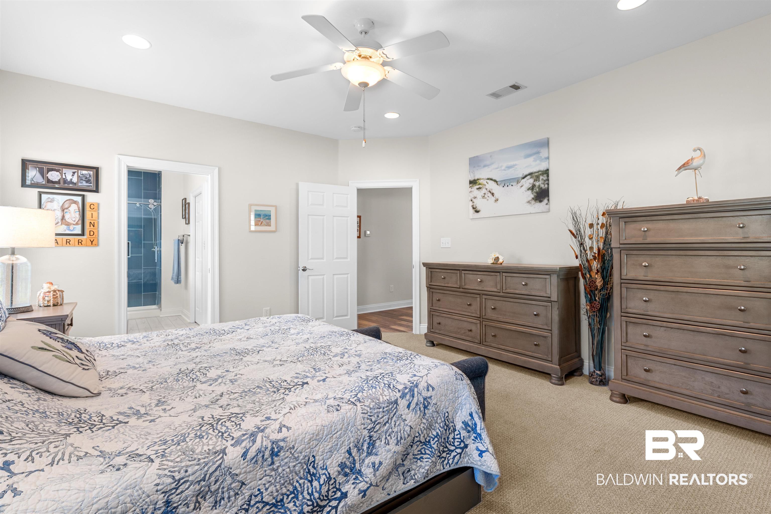 141 Mark Twain Loop Foley, AL 36535 - Photo 17 of 55 Bedroom with recessed lighting, light colored carpet, ceiling fan, and ensuite bathroom