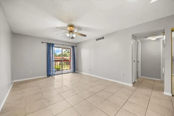 a view of an empty room with a window