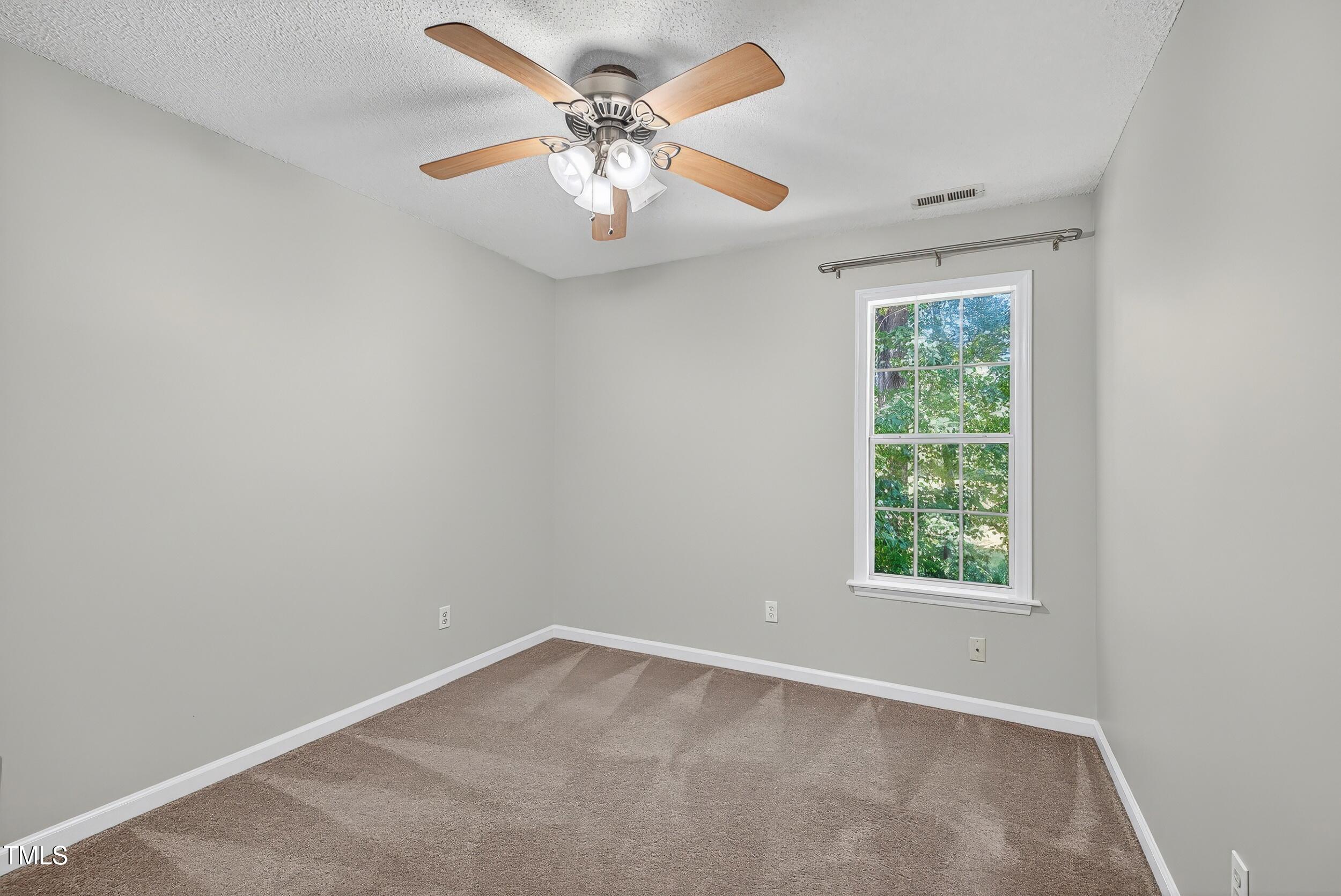 532 Baygall Road Holly Springs, NC 27540 - Photo 12 of 15 an empty room with a window