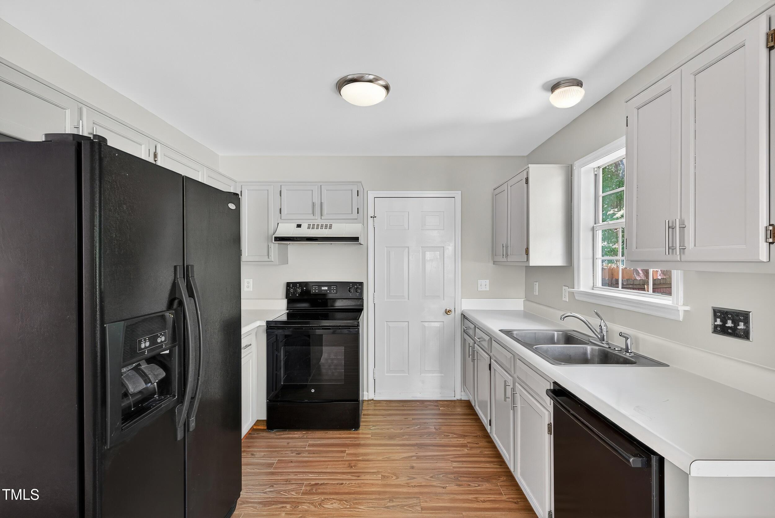 532 Baygall Road Holly Springs, NC 27540 - Photo 4 of 15 a kitchen with a refrigerator and a sink