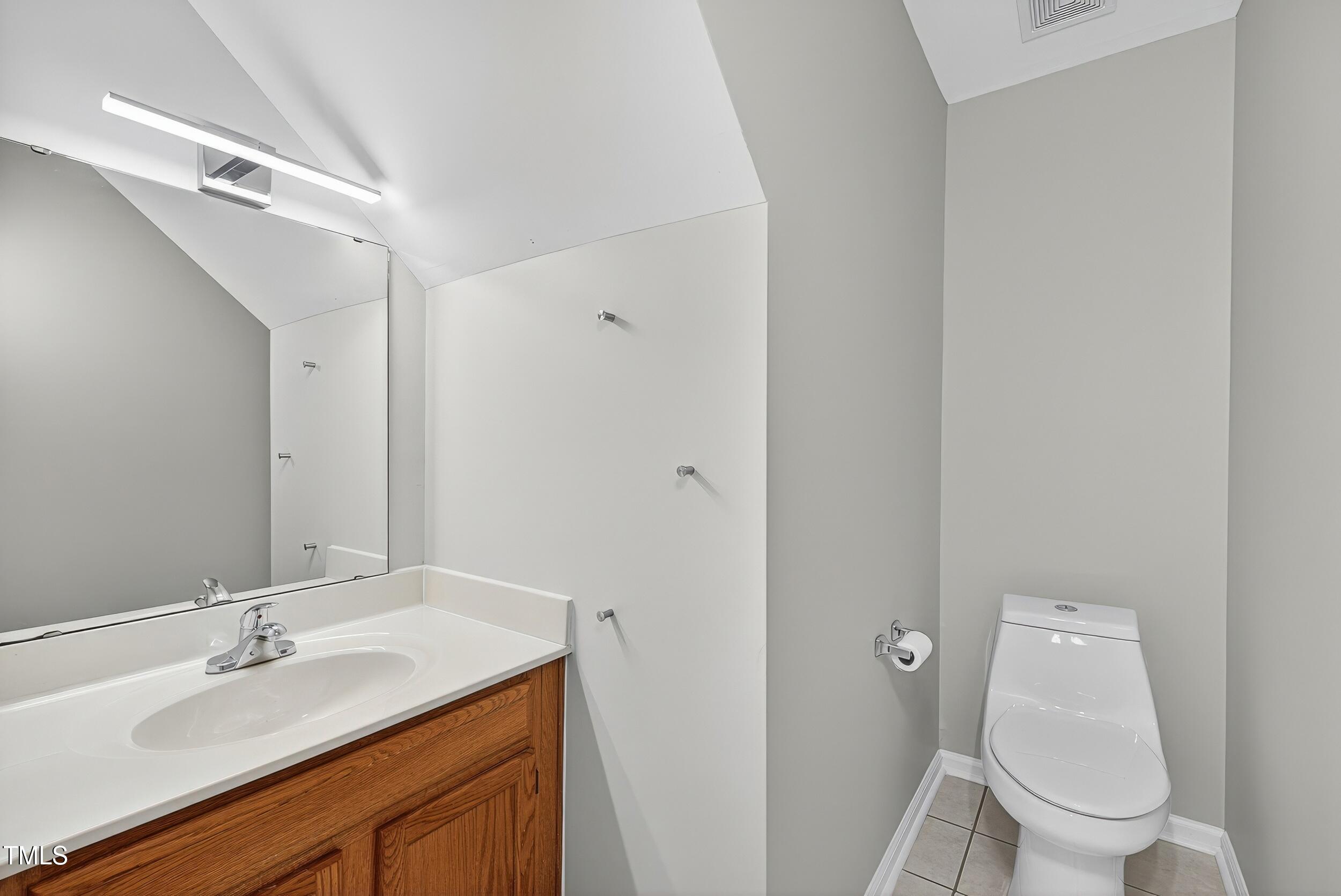 532 Baygall Road Holly Springs, NC 27540 - Photo 7 of 15 a bathroom with a granite countertop sink toilet and shower