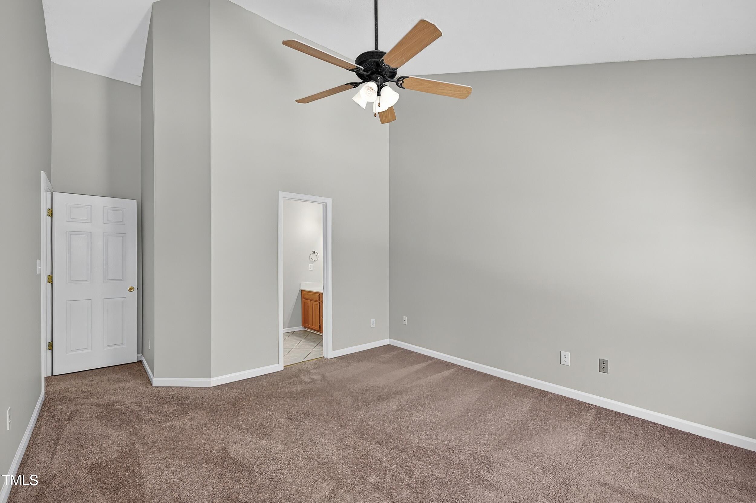 532 Baygall Road Holly Springs, NC 27540 - Photo 9 of 15 a view of an empty room with a fan
