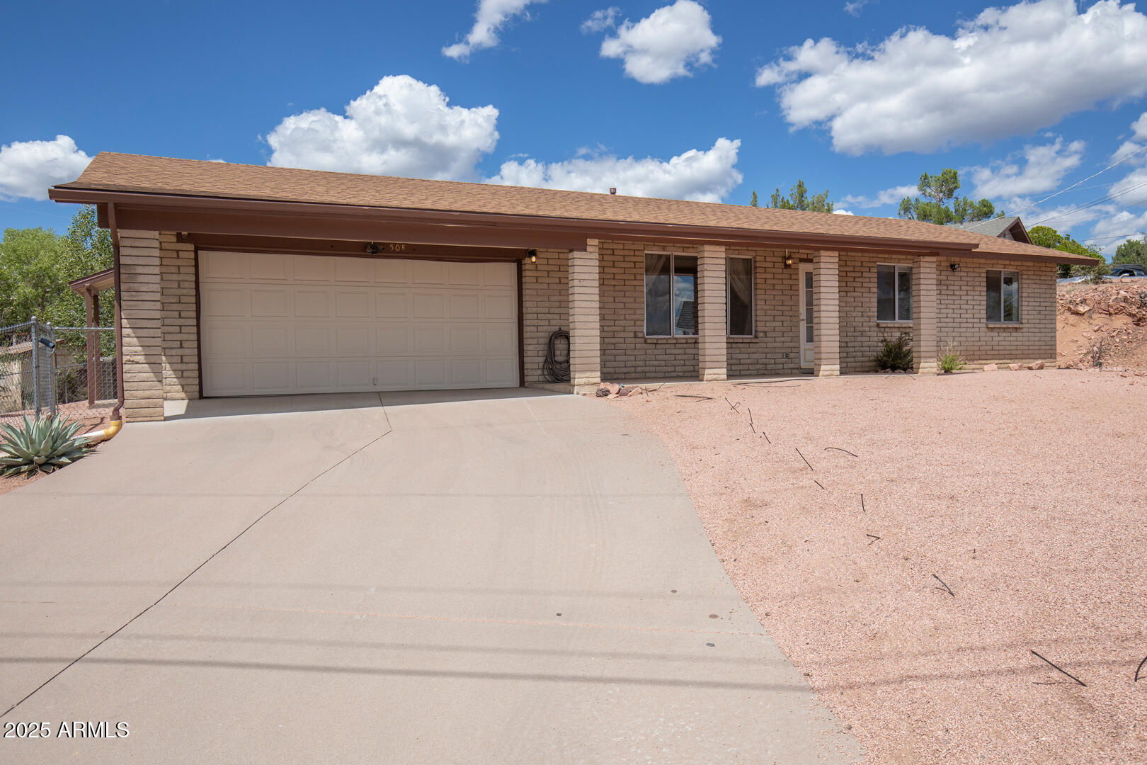 a front view of a house with a garage