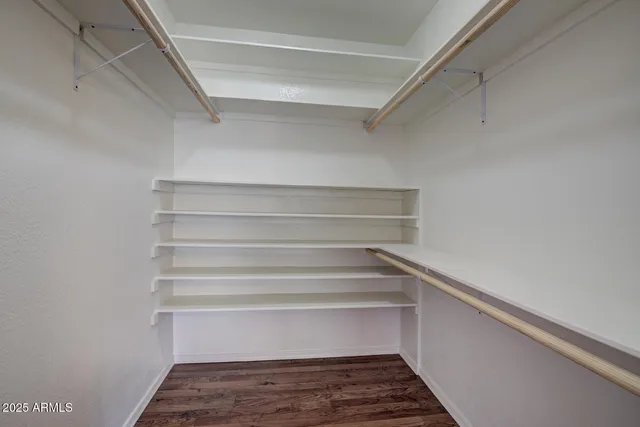 a view of a room with stairs and a closet