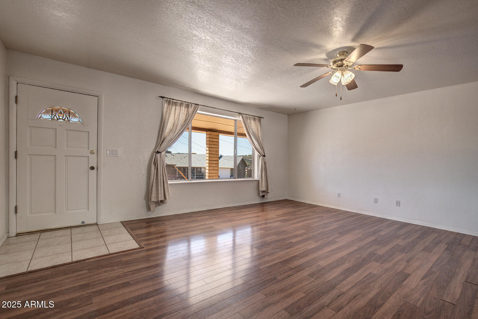 508 South Meadow Street Payson, AZ 85541 - Photo 2 of 29 wooden floor in an empty room with a window