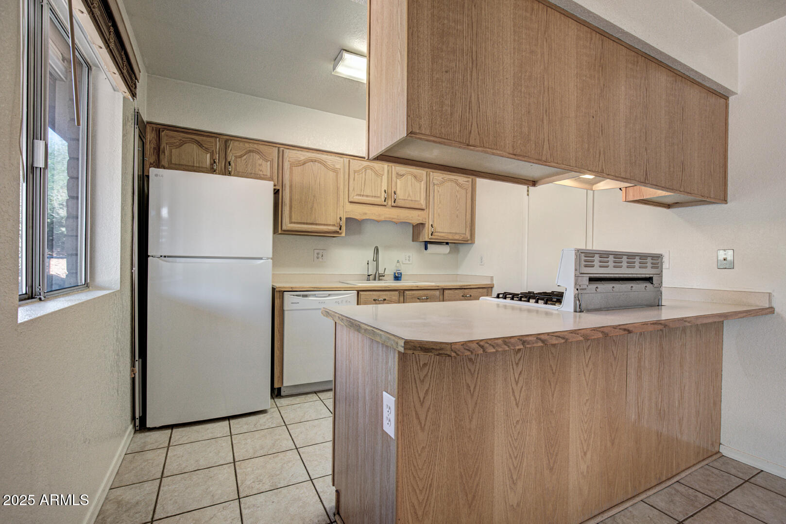 508 South Meadow Street Payson, AZ 85541 - Photo 5 of 29 a kitchen with stainless steel appliances granite countertop a refrigerator sink and cabinets