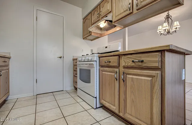 a utility room with cabinets dryer and washer
