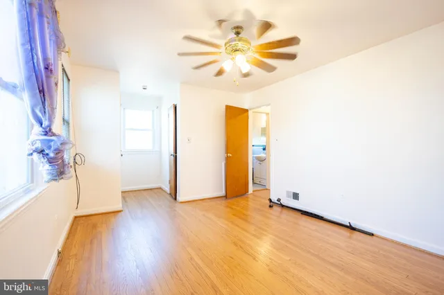 a view of a livingroom with wooden floor