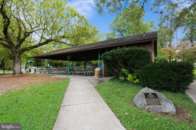 a view of a swimming pool with a outdoor seating
