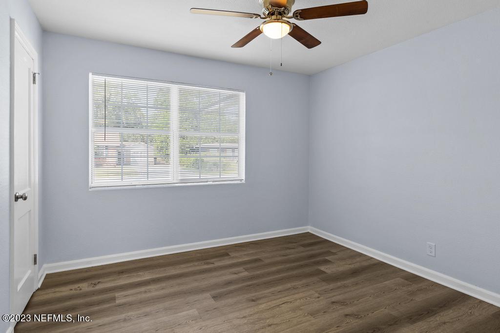 1505 Glengarry Road Jacksonville, FL 32207 - Photo 18 of 65 a view of an empty room with wooden floor and a window