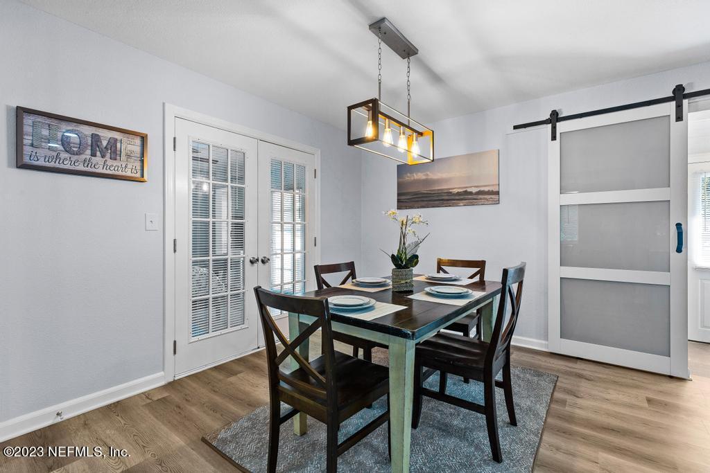 1505 Glengarry Road Jacksonville, FL 32207 - Photo 26 of 65 a view of a dining room with furniture and wooden floor