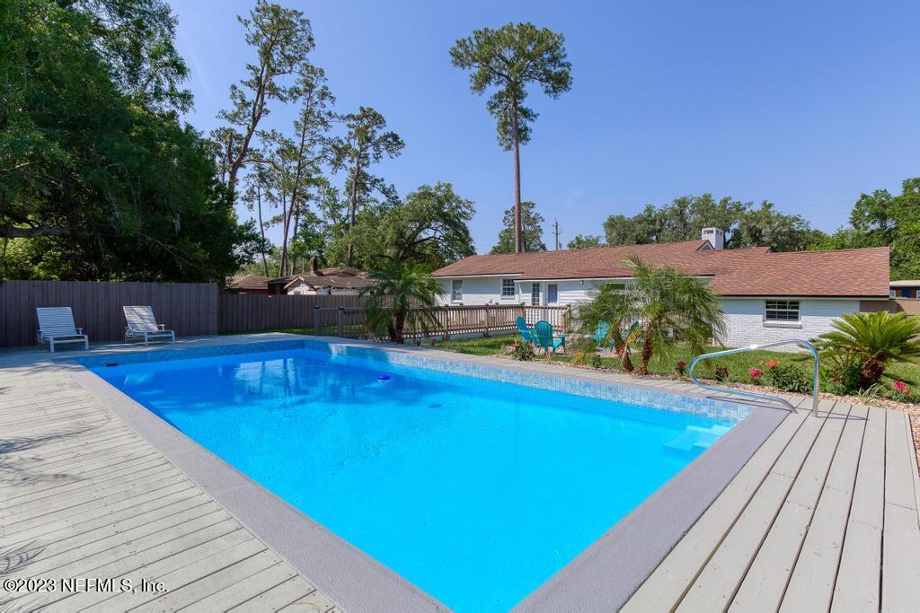 1505 Glengarry Road Jacksonville, FL 32207 - Photo 52 of 65 a view of a swimming pool with a patio