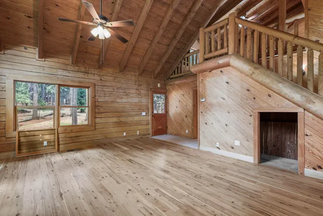 a spacious bathroom with a toilet sink and mirror