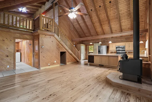 a kitchen with sink stove and cabinets