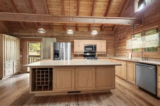 a kitchen with a stove a refrigerator and a stove