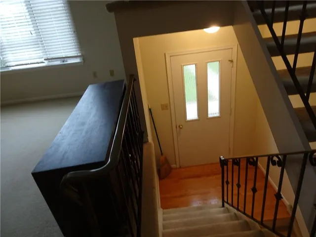 a view of a room with chairs and window