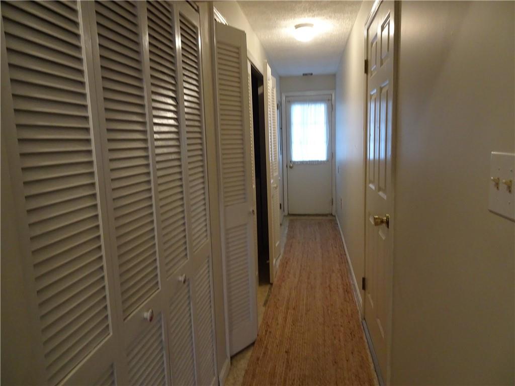 109 Canterbury Commons Indiana, PA 15701 - Photo 20 of 22 a view of a hallway with wooden floor