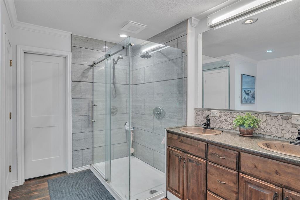 860 County Road 1627 Rusk, TX 75785 - Photo 13 of 37 a bathroom with a shower sink and mirror
