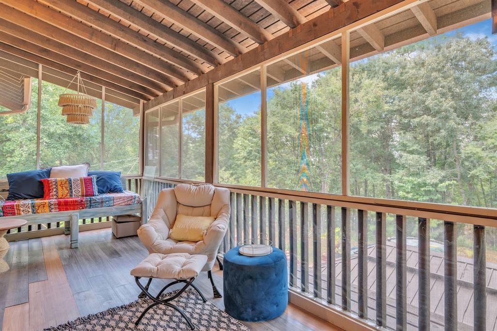 860 County Road 1627 Rusk, TX 75785 - Photo 17 of 37 a balcony with furniture and a potted plant