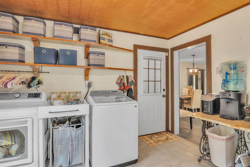 860 County Road 1627 Rusk, TX 75785 - Photo 18 of 37 a utility room with a sink a washer and dryer