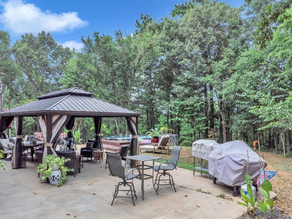 860 County Road 1627 Rusk, TX 75785 - Photo 20 of 37 a view of backyard with seating space and trees