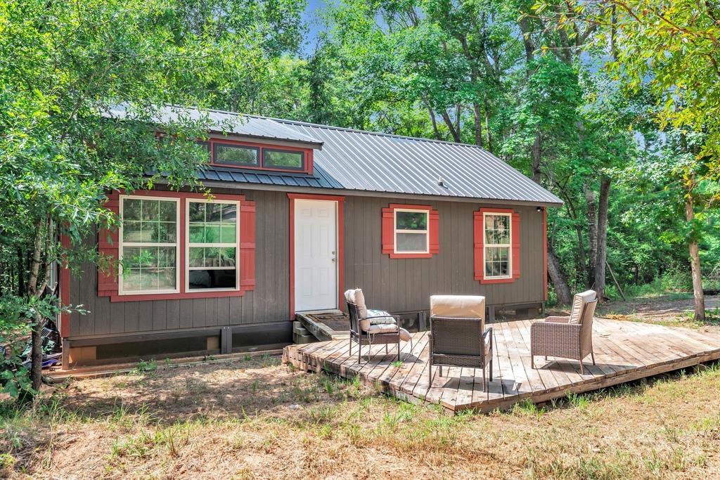 860 County Road 1627 Rusk, TX 75785 - Photo 21 of 37 a backyard of a house with yard and outdoor seating
