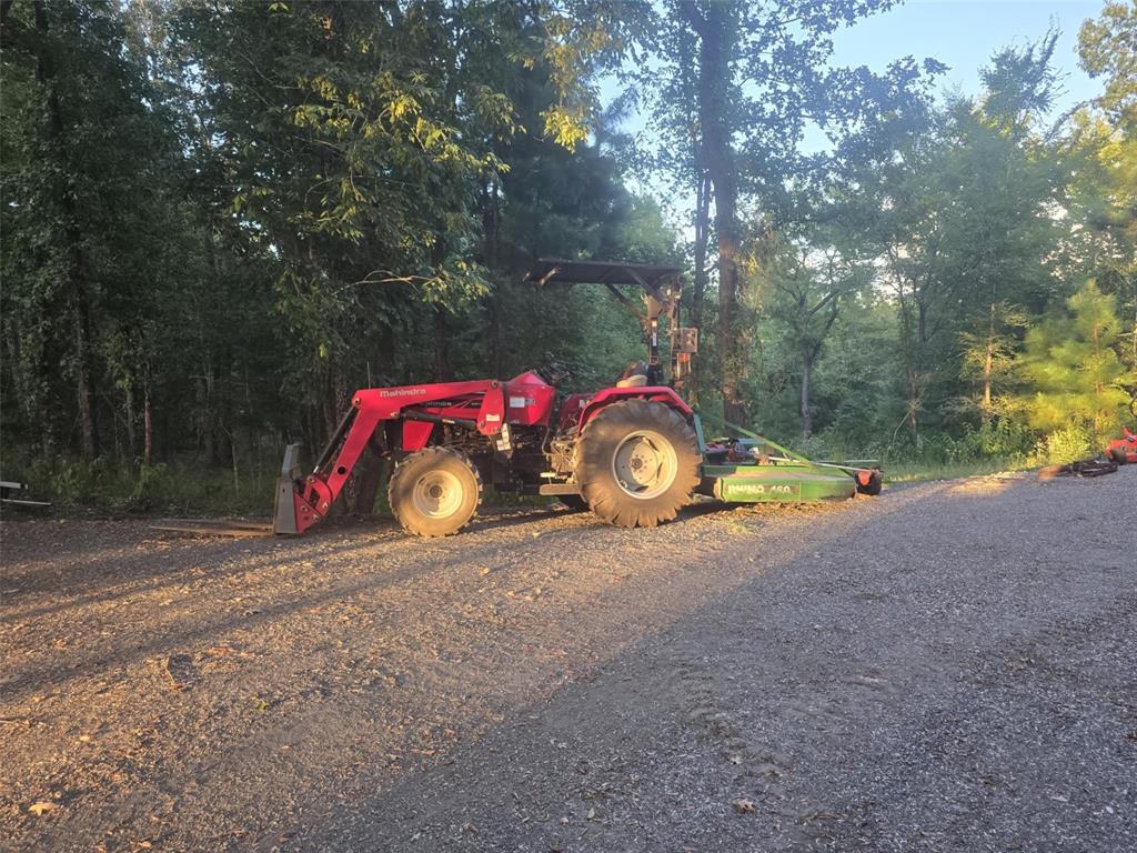 860 County Road 1627 Rusk, TX 75785 - Photo 34 of 37 a view of a wooden house with a car parked on the road