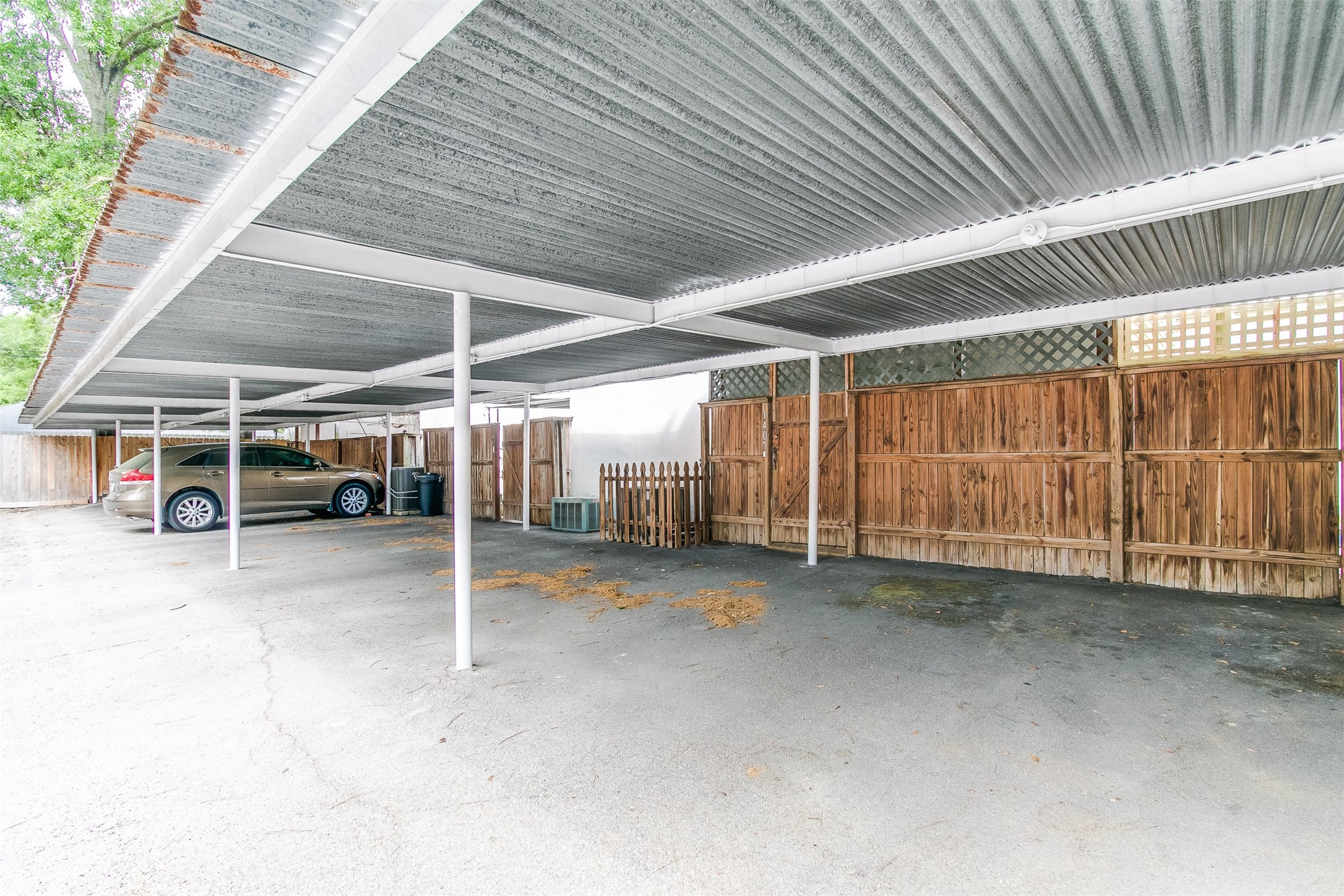 1407 Springrock Lane Houston, TX 77055 - Photo 18 of 25 Your vehicle is safe from the elements under this covered parking space.